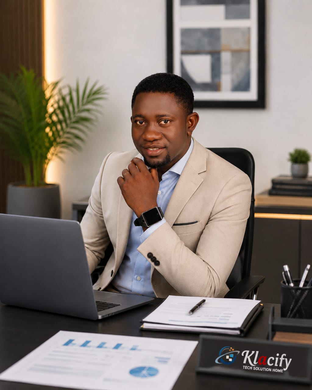 KONFRID DIGITEX consultant working at a modern office desk with a laptop and reports